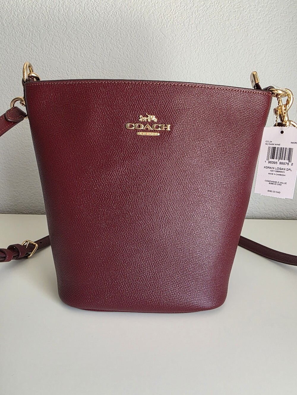 Coach NY Crossgrain Leather Logan Duffle Bag In Dark Wine, IM Gold, NWT
